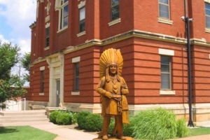 Chainsaw Sculpture of Chief Lone Wolf next to the Kiowa County Courthouse