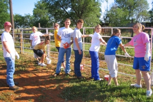 Students helping to paint the Hobart Riding Club arena as the Jr. Main Street 