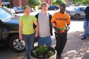 Planting flowers downtown in the planter barrels was part of 